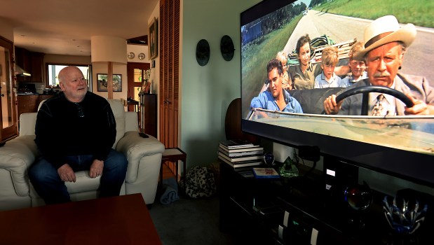 Santa Rosa resident Robin Koon, left, watches the 1962 release of "Follow That Dream", Wednesday, Dec. 31, 2025, starring Elvis Presley. Koon, along with his twin brother Gavin, were cast alongside Elvis Presley, Anne Helm and Arthur O'Connell, right. Robin is left middle. The film was made in Florida in 1961. (Kent Porter / The Press Democrat)