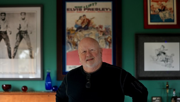Santa Rosa resident Robin Koon with a poster of the 1962 release of "Follow That Dream", starring Elvis Presley. Robin Koon and twin brother Gavin, were featured alongside Presley, Anne Helm and Arthur O'Connell. The film was made in 1961 in Florida. (Kent Porter / The Press Democrat)