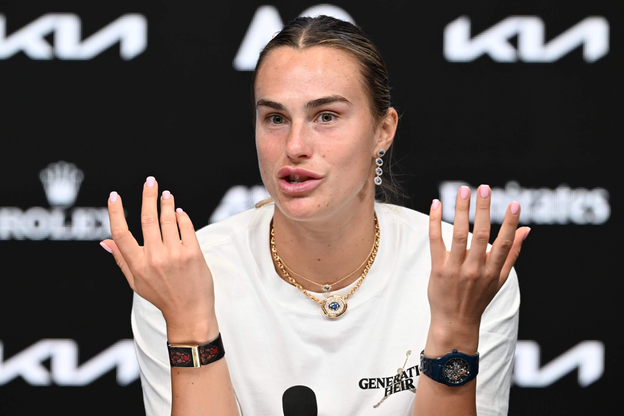 World No. 1 Aryna Sabalenka wears a Whoop wearable on her right hand during a news conference. 