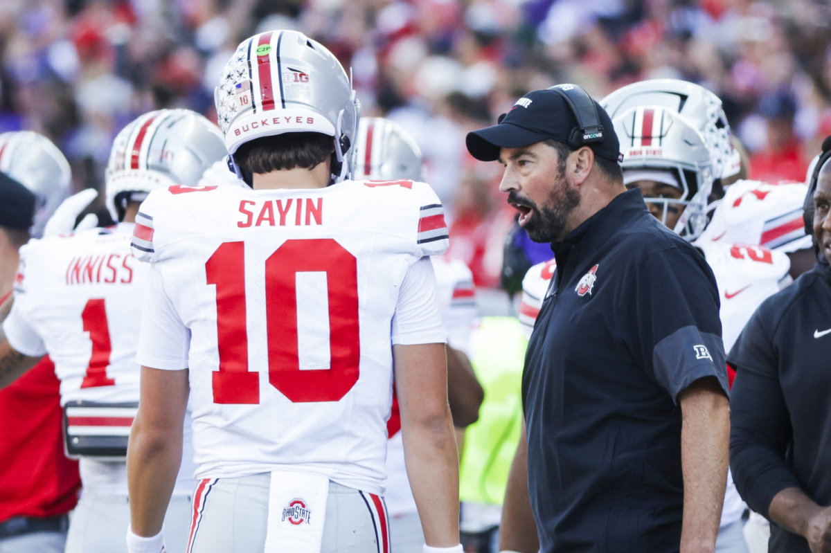 Sep 27, 2025; Seattle, Washington, USA; Ohio State Buckeyes head coach Ryan Day speaks with quarterback Julian Sayin (10) during a fourth quarter timeout against the Washington Huskies at Husky Stadium. Mandatory Credit: Joe Nicholson-Imagn Images Sep 27, 2025; Seattle, Washington, USA; Ohio State Buckeyes head coach Ryan Day speaks with quarterback Julian Sayin (10) during a fourth quarter timeout against the Washington Huskies at Husky Stadium. Mandatory Credit: Joe Nicholson-Imagn Images