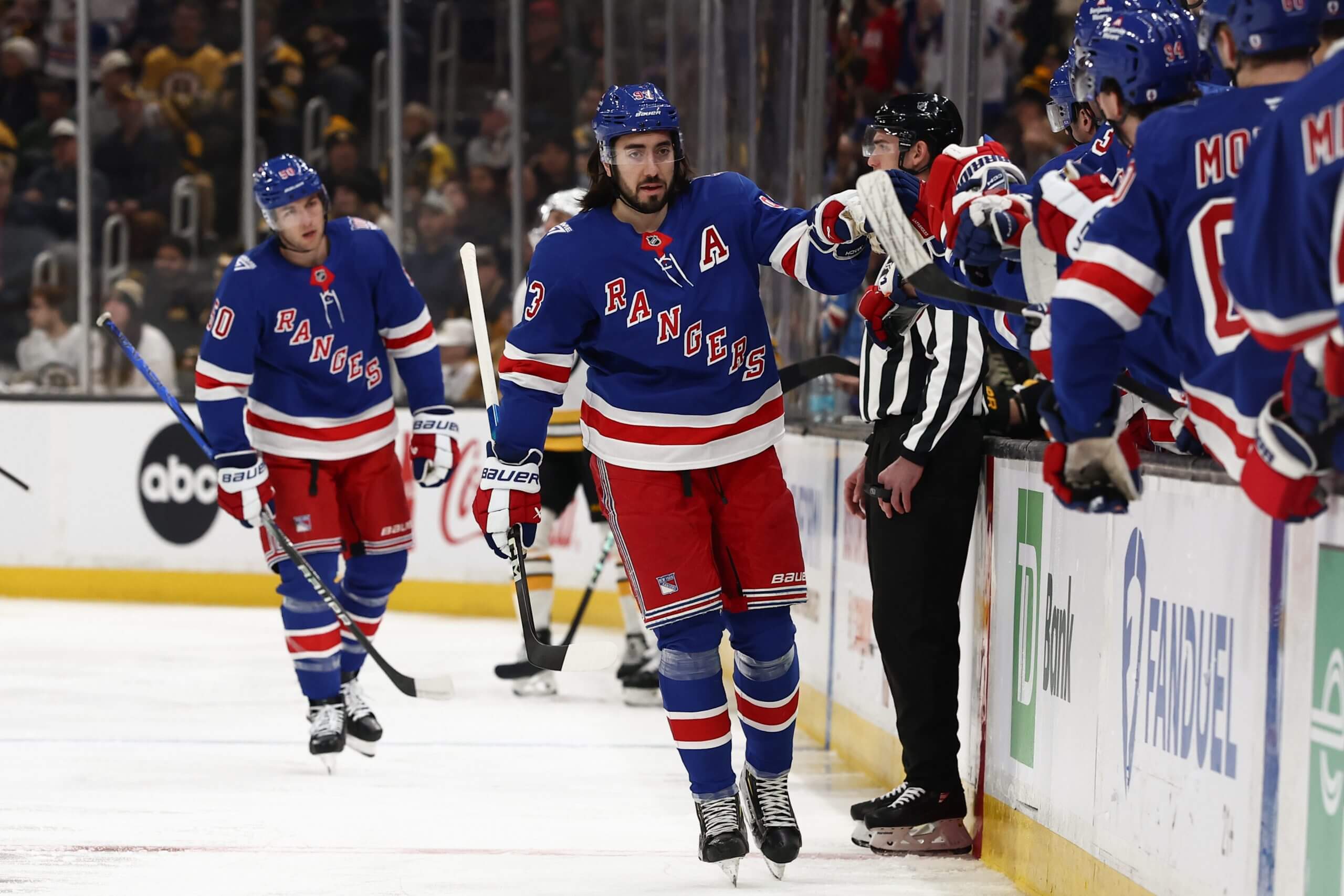 Mika Zibanejad makes his way down the Rangers' fist-bump line.