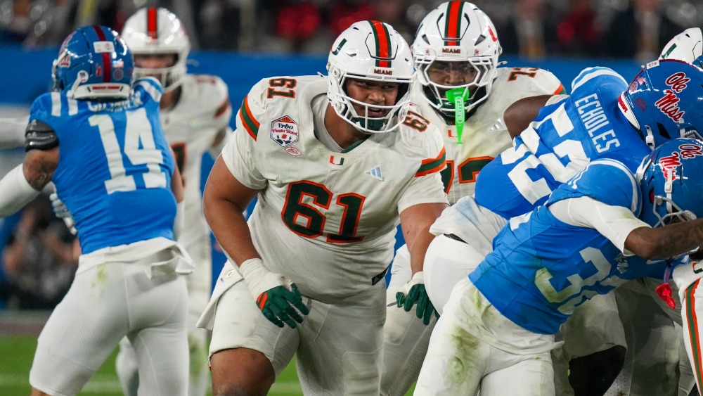 University of Miami tackle Francis Mauigoa pushing pile, Jan. 8, 2026 Fiesta Bowl (Jeremy Schnell/A...