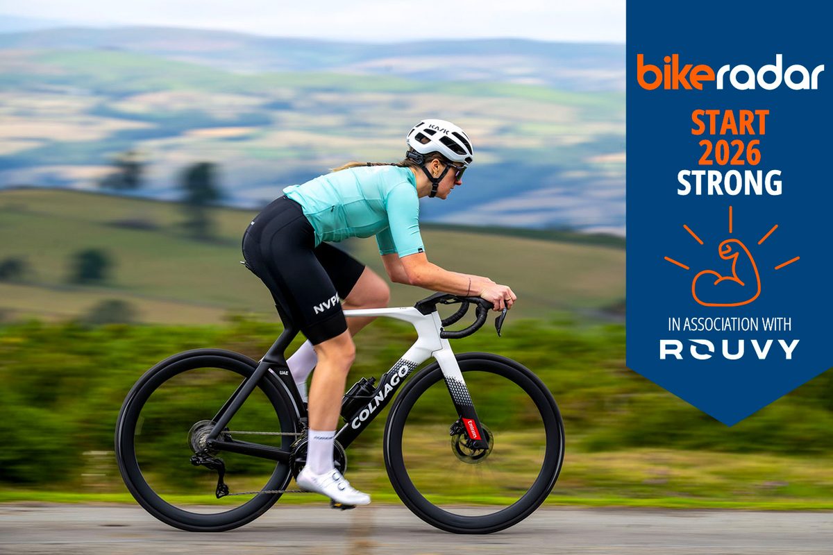 Woman on Colnago with Rouvy banner