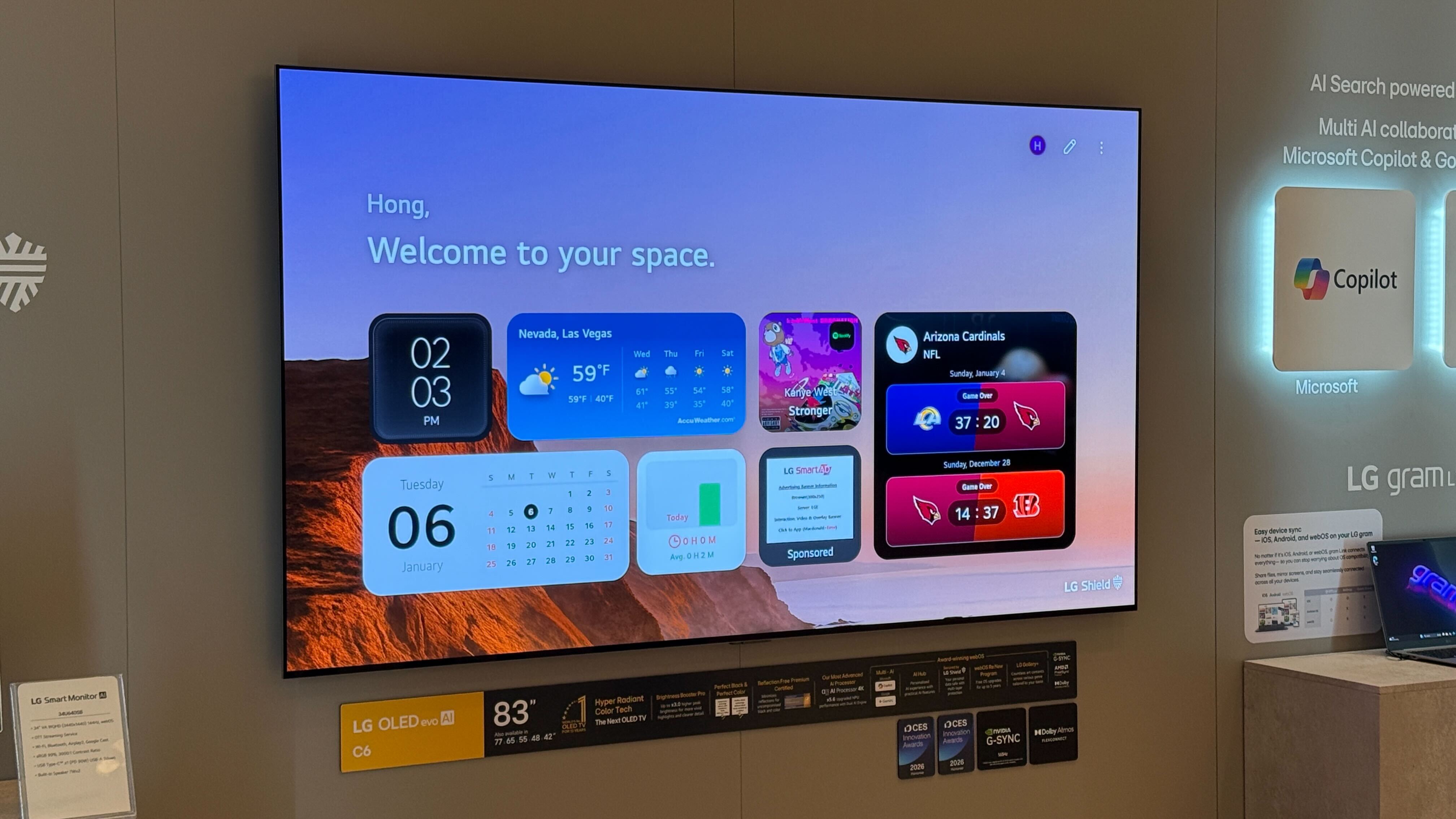 Wall mounted LG C6 with a home page full of widgets on screen