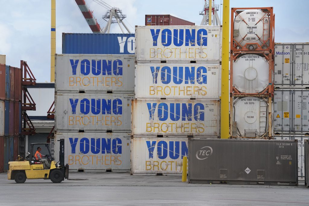 Shipping containers stacked at the Young Brothers shipping area located at Piers 39 and 40 in Honolulu Harbor.