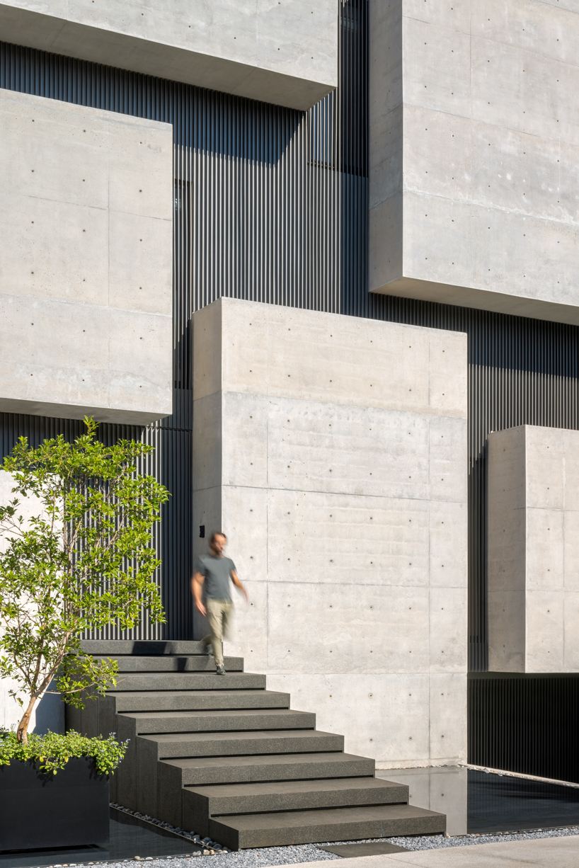 six extruded concrete volumes sculpt brutalist villa’s facade in mexico city