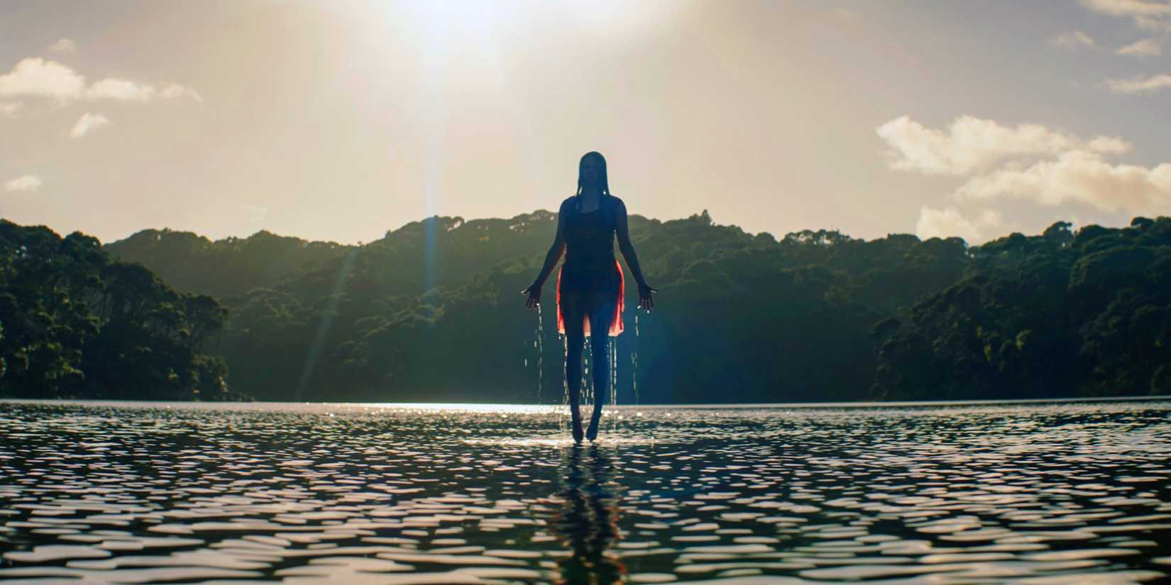 A woman floats on water in Evil Dead Rise