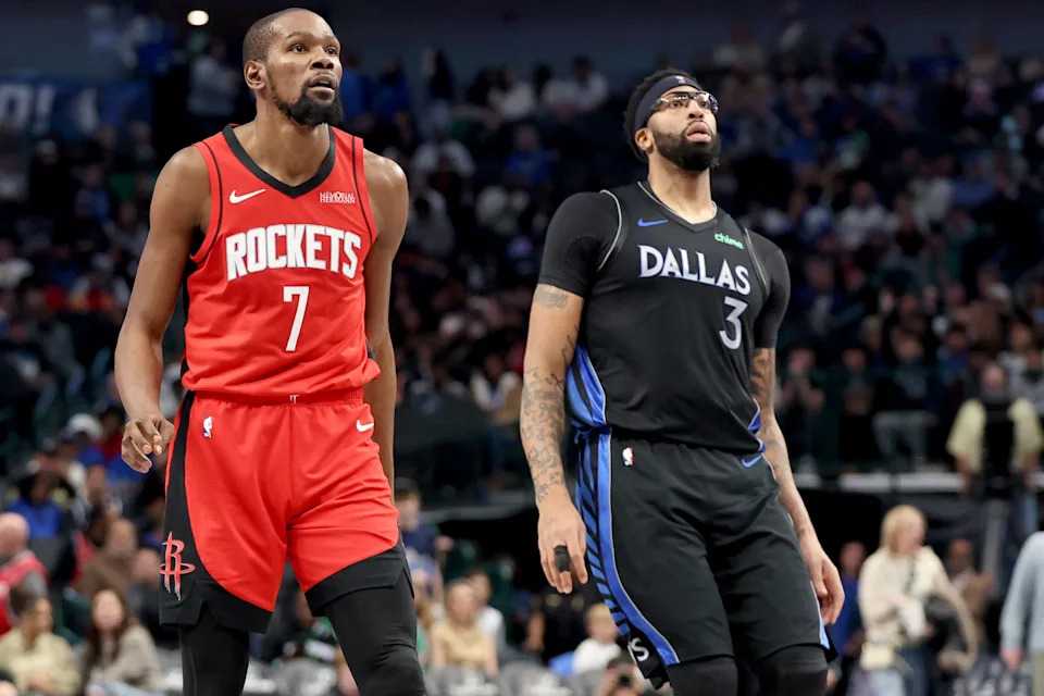 DALLAS, TEXAS - DECEMBER 06: Kevin Durant #7 of the Houston Rockets and Anthony Davis #3 of the Dallas Mavericks watch a shot during the second half at American Airlines Center on December 06, 2025 in Dallas, Texas. NOTE TO USER: User expressly acknowledges and agrees that, by downloading and or using this photograph, User is consenting to the terms and conditions of the Getty Images License Agreement. (Photo by Tim Heitman/Getty Images)