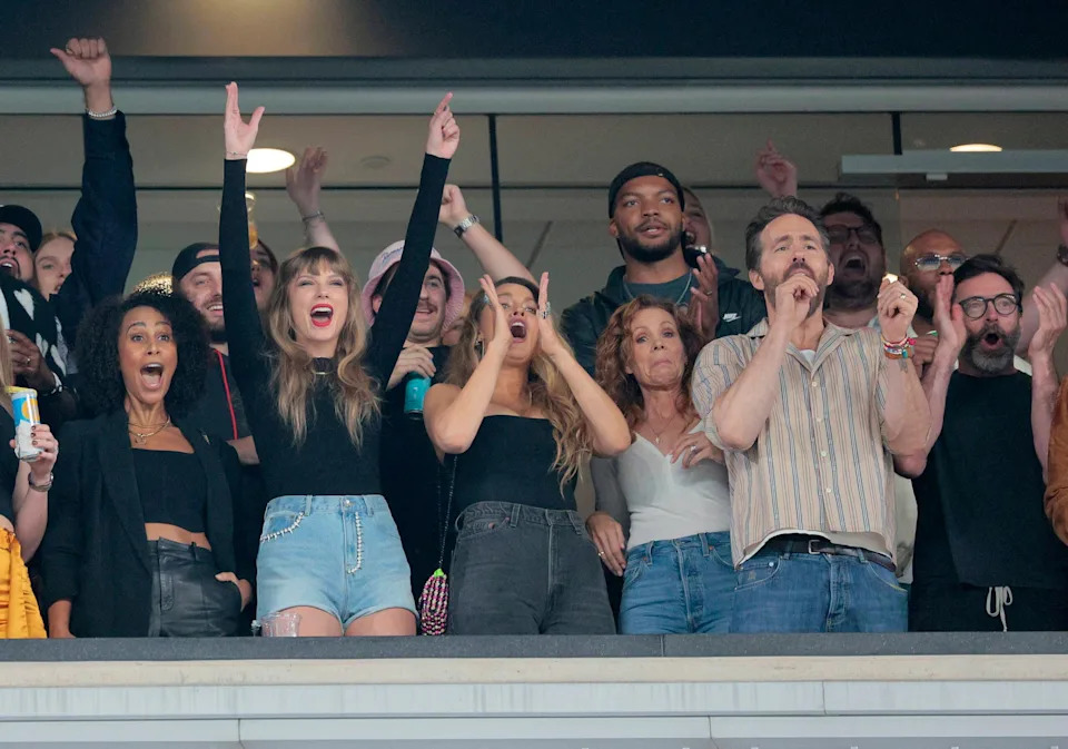 Singer Taylor Swift along with Actors Blake Lively, Ryan Reynolds, and Hugh Jackman at Jets Chiefs game