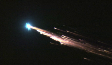 a bright fireball streaks across the sky