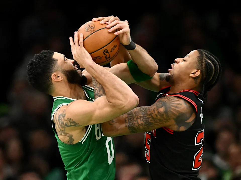 BOSTON, MASSACHUSETTS - JANUARY 29: Jayson Tatum #0 of the Boston Celtics and Dalen Terry #25 of the Chicago Bulls battle for the ball during the fourth quarter at the TD Garden on January 29, 2025 in Boston, Massachusetts. NOTE TO USER: User expressly acknowledges and agrees that, by downloading and or using this photograph, User is consenting to the terms and conditions of the Getty Images License Agreement. (Photo by Brian Fluharty/Getty Images)