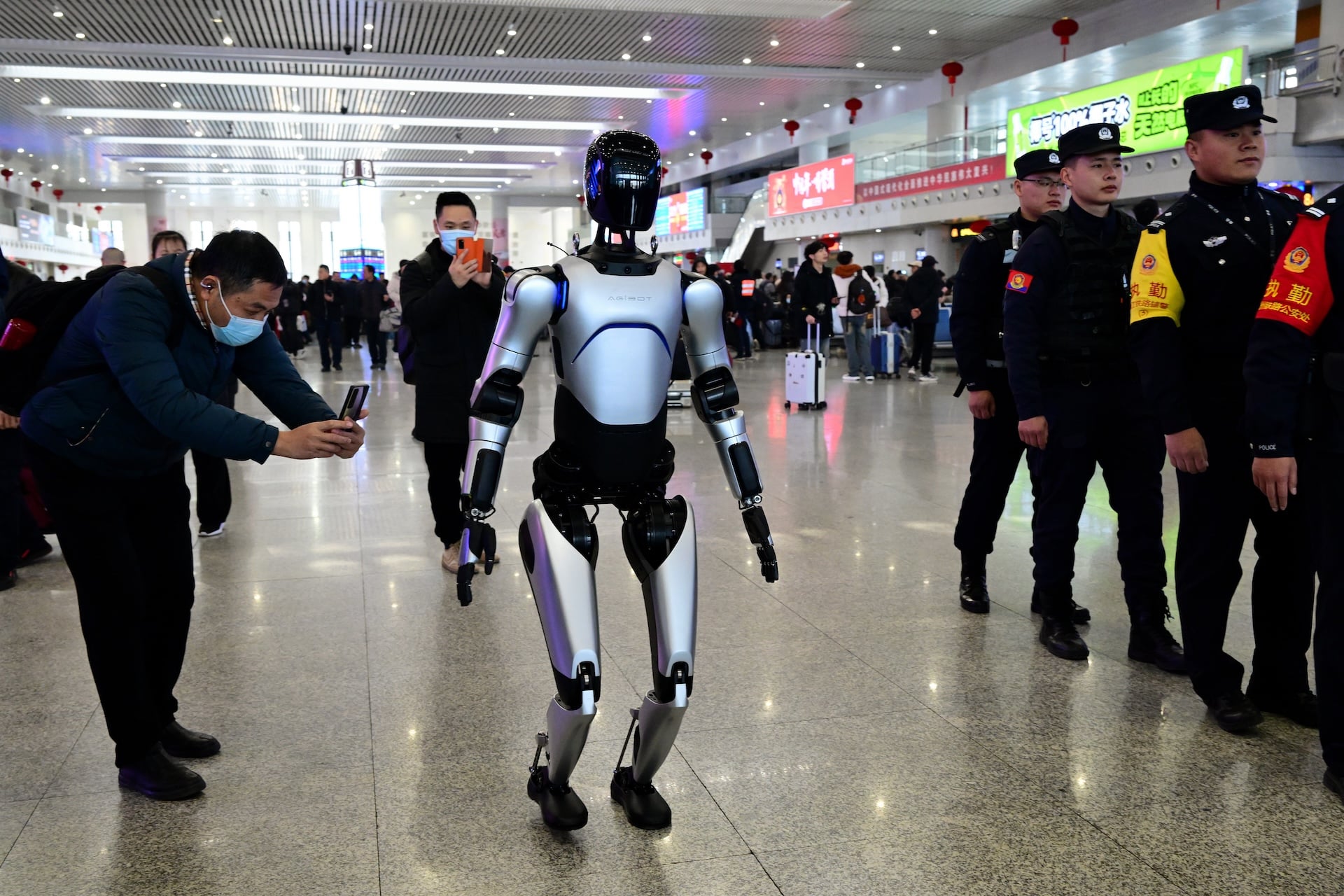 AgiBot humanoid robot patrols at the waiting hall of Jinhua railway station on the first day of the Spring Festival travel rush on January 14, 2025 in Jinhua, Zhejiang Province of China.