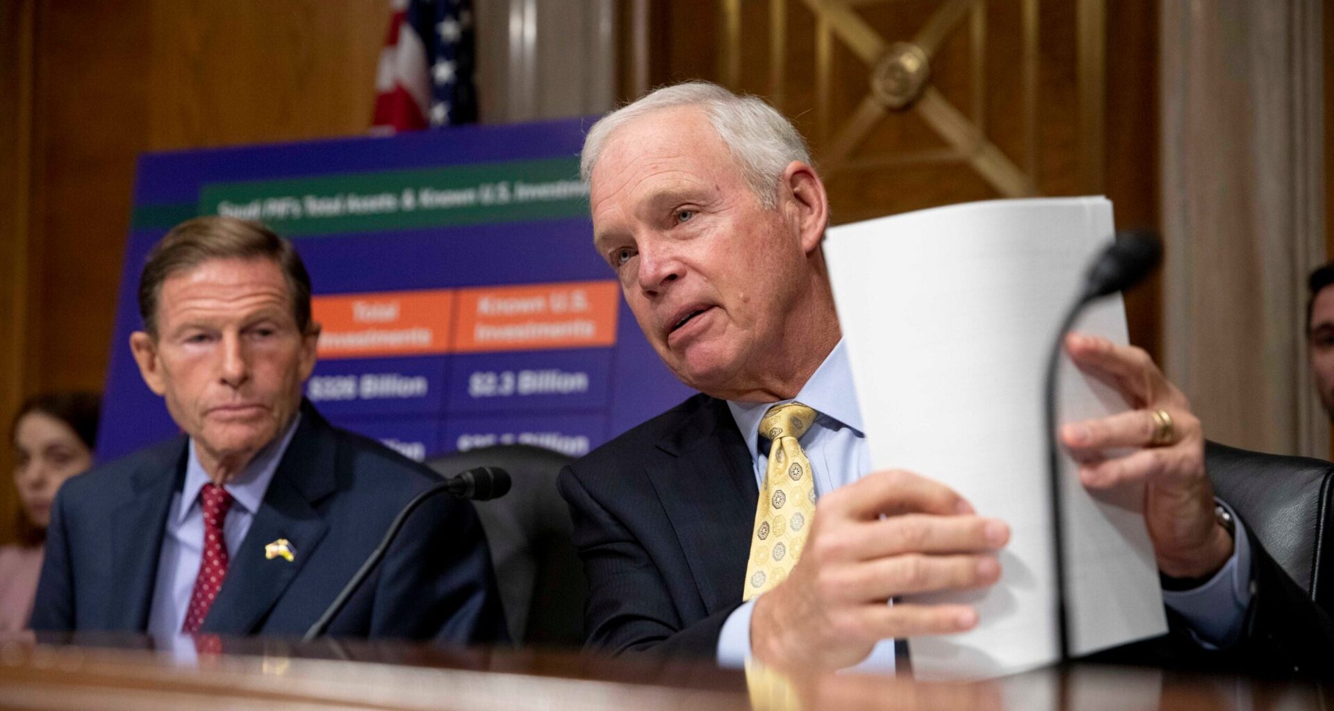 Sen. Ron Johnson holds papers during a congressional subcommittee meeting on Capitol Hill