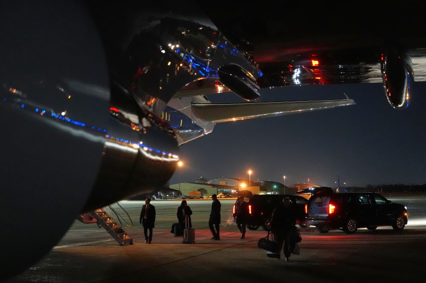 Things are unloaded from Air Force One after the plane, carrying President Donald Trump to the World Economic Form in Davos, experienced a minor electrical issue after departure, Tuesday, and returned to Joint Base Andrews, Maryland.