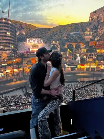 Bella Hadid and Adan Banuelos sharing a kiss in a carousel of Instagram photos shared by Banuelos Adan Banuelos/Instagram
