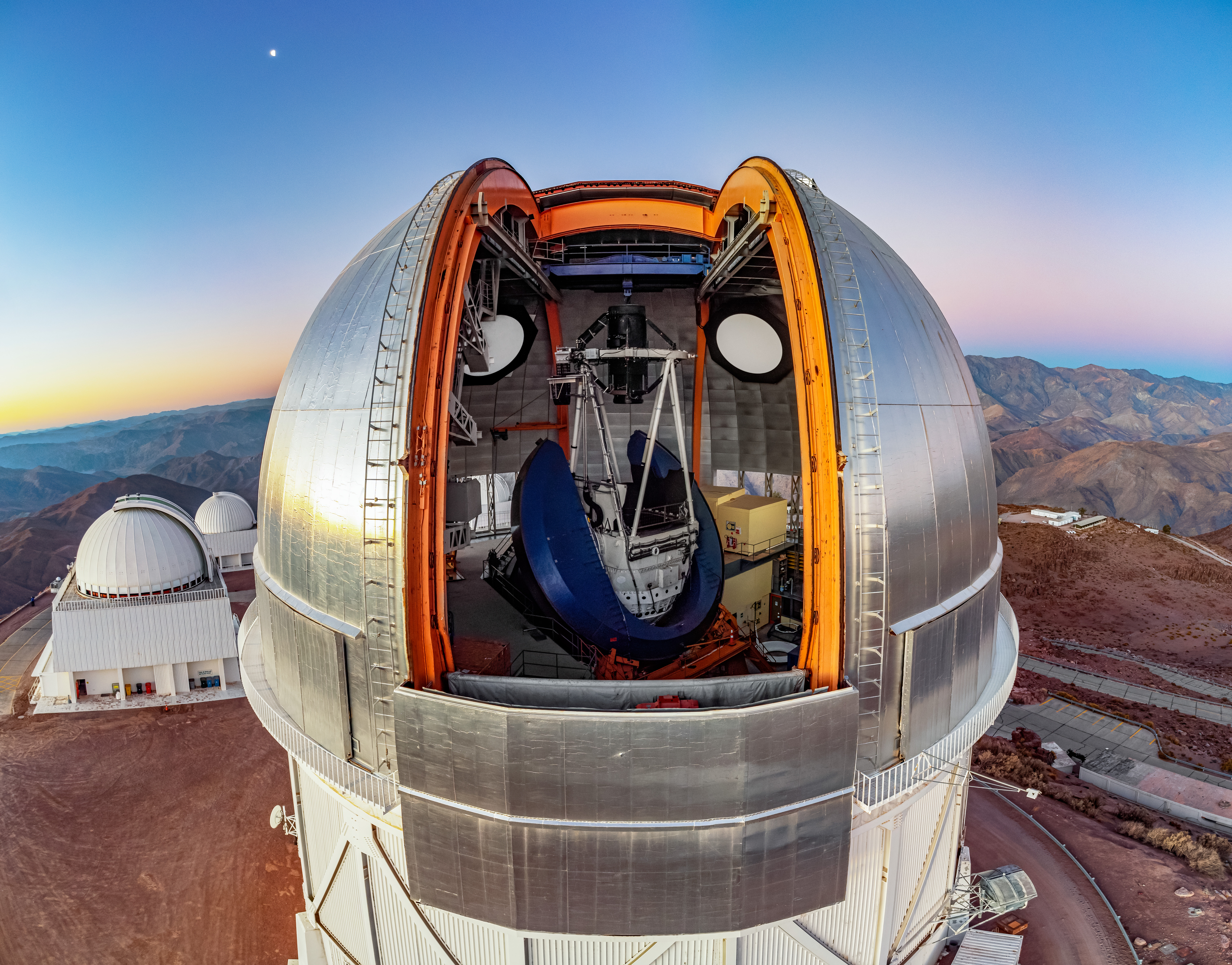 Aerial photo of the telescope. Image shows a view into the open dome of the telescope.
