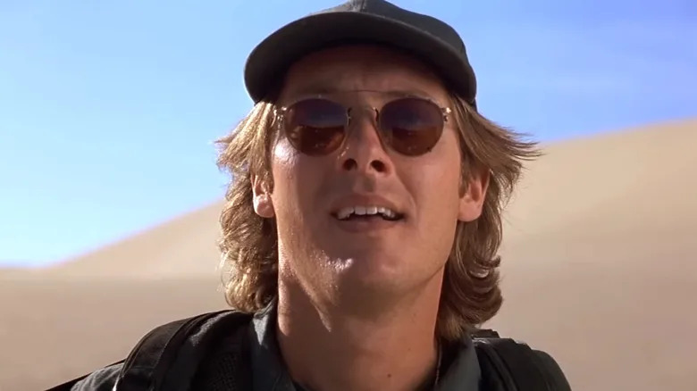 Daniel Jackson standing in the desert in Stargate