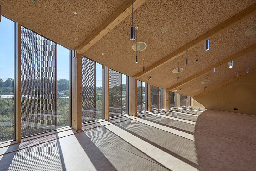 watch: ballet dancers take over BIG's circular timber building of dymak HQ in denmark