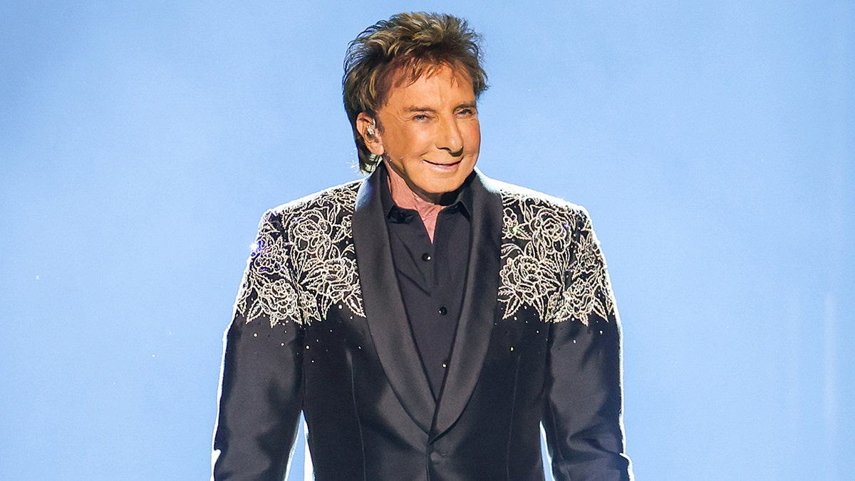 Barry Manilow performing on stage at the "Manilow: The Last Seattle Concert" in July 2025.