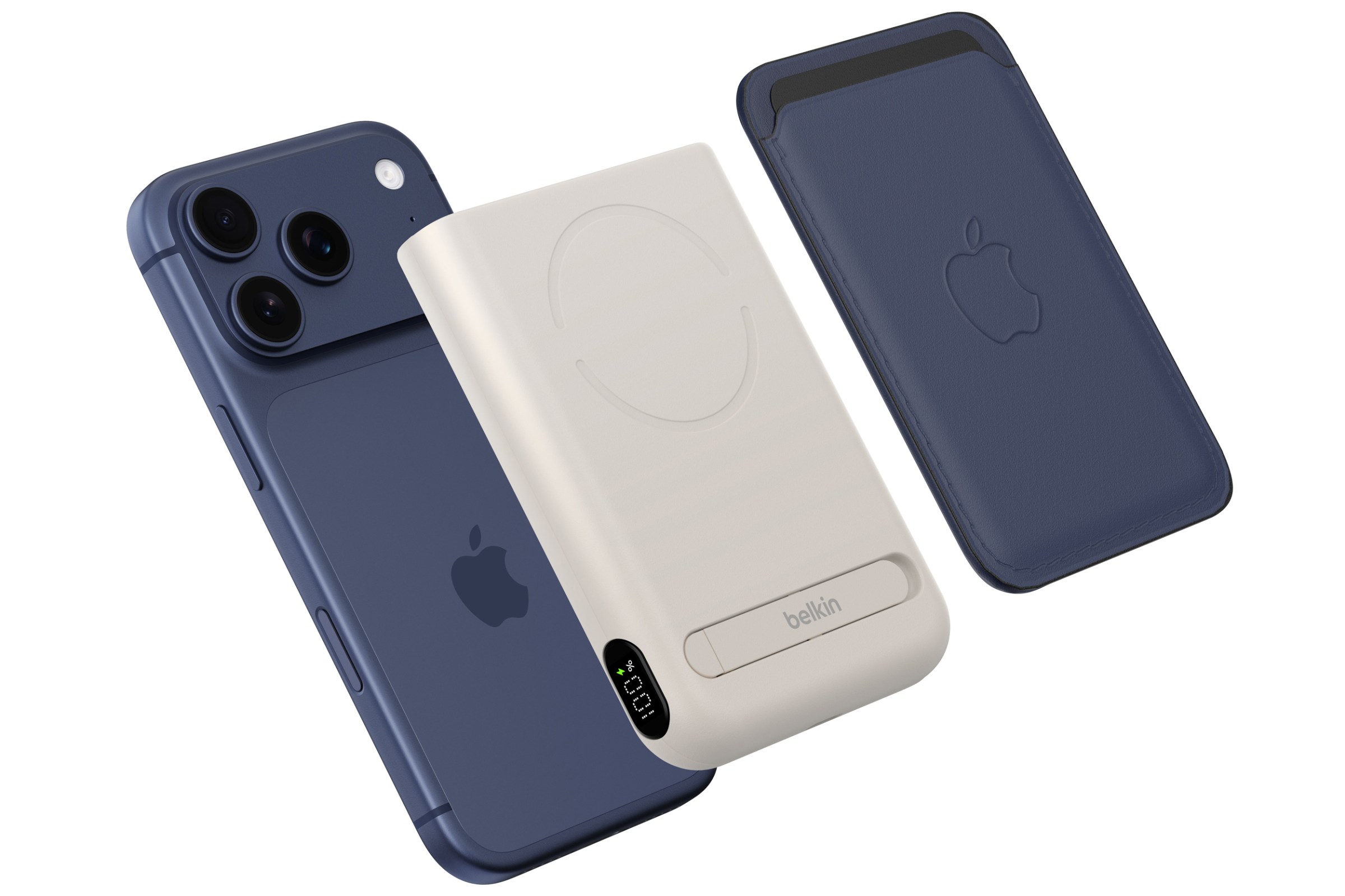 The Belkin UltraCharge Pro Power Bank 10K with Magnetic Ring floating between an iPhone and a MagSafe wallet.