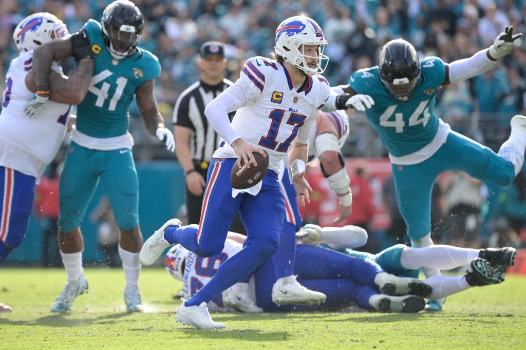 Buffalo Bills quarterback Josh Allen (17) runs with the ball during a game against the Jacksonville Jaguars.