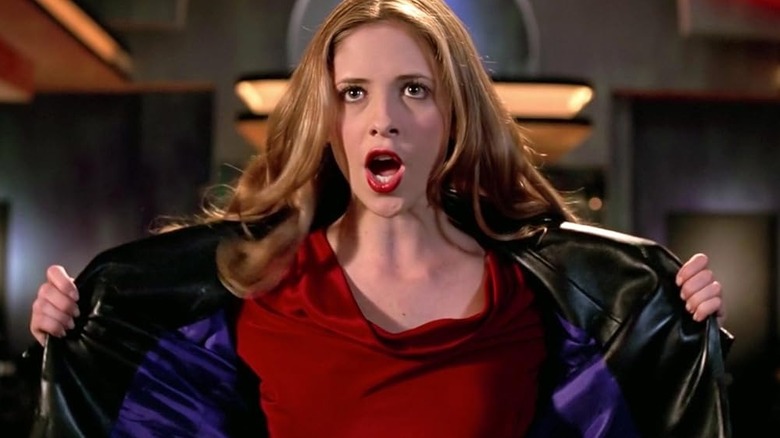 Sarah Michelle Gellar as Buffy opening her jacket while singing in Buffy the Vampire Slayer