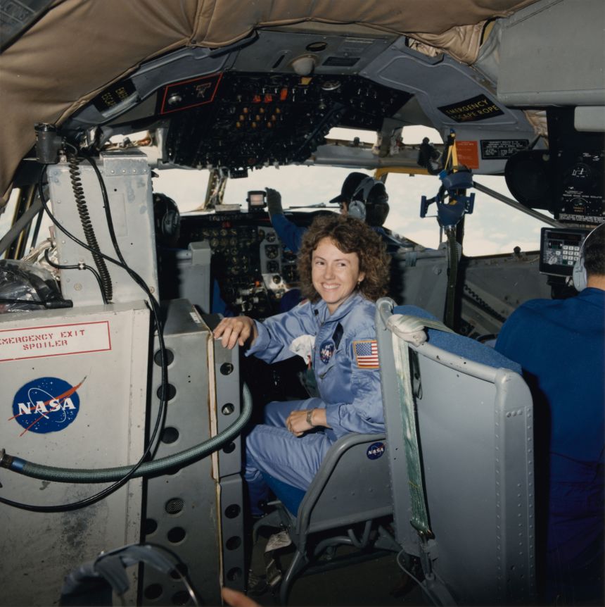 Christa McAuliffe smiles before participating in zero gravity rehearsals in October 1985.