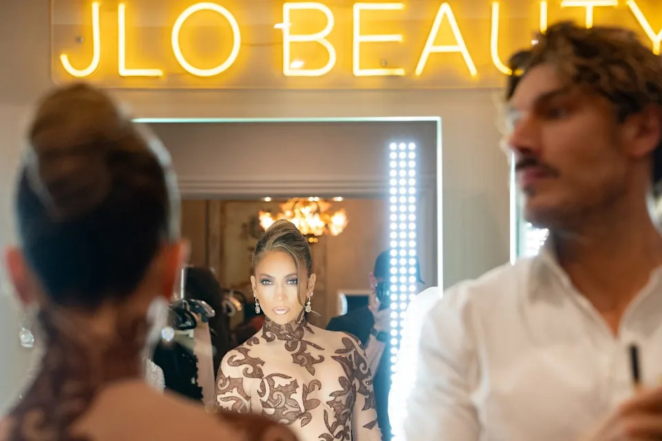 makeup scene with a beauty neon sign and reflections