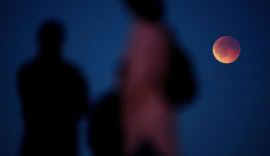 People watch a blood moon during a total lunar eclipse in Køge, Denmark, in September. Mads Claus Rasmussen/Ritzau Scanpix Denmark/Reuters via CNN Newsource