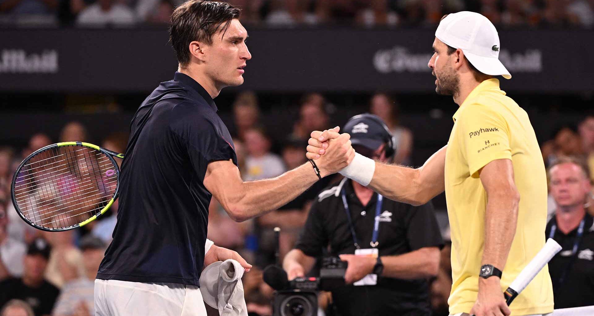 Raphael Collignon and Grigor Dimitrov at the net following their first Lexus ATP Head2Head meeting.
