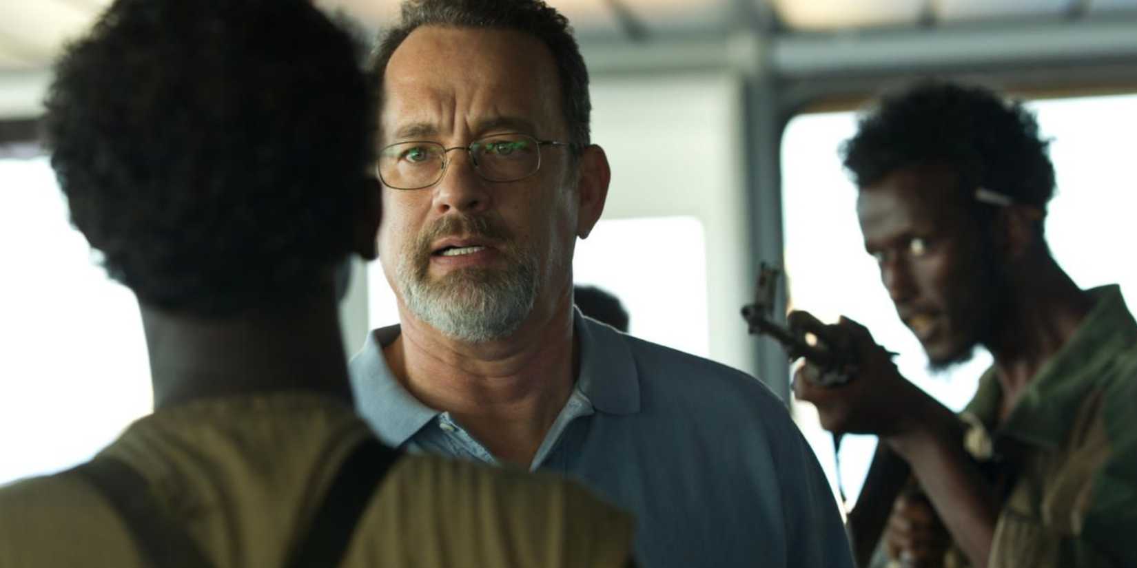 Tom Hanks being held at gunpoint by Somali pirates in Captain Phillips
