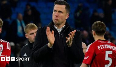 Gary Caldwell applauds the travelling Exeter City fans after the defeat