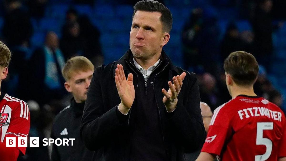 Gary Caldwell applauds the travelling Exeter City fans after the defeat