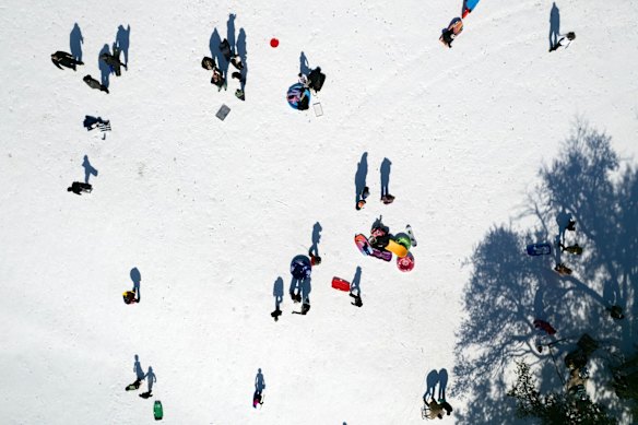 People sledging in Dallas, Texas.