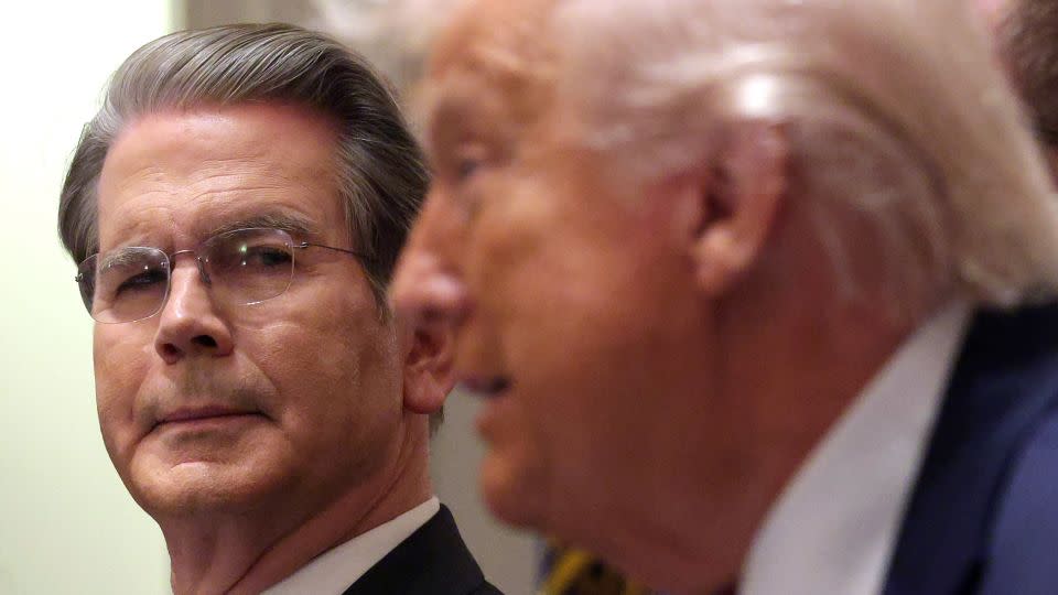 Bessent looks on as Trump delivers remarks during a roundtable discussion in the White House on December 8, 2025 in Washington, DC. - Alex Wong/Getty Images