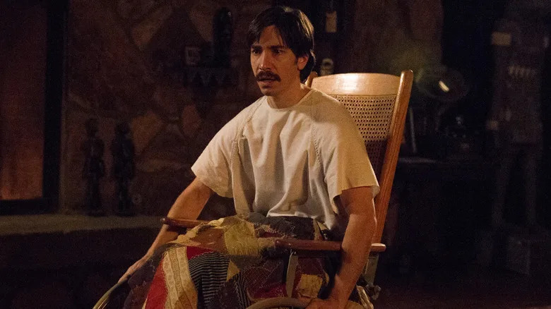 Justin Long as Wallace sitting in his wheelchair in Tusk