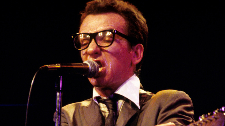 Elvis Costello sneering on stage in the 1970s