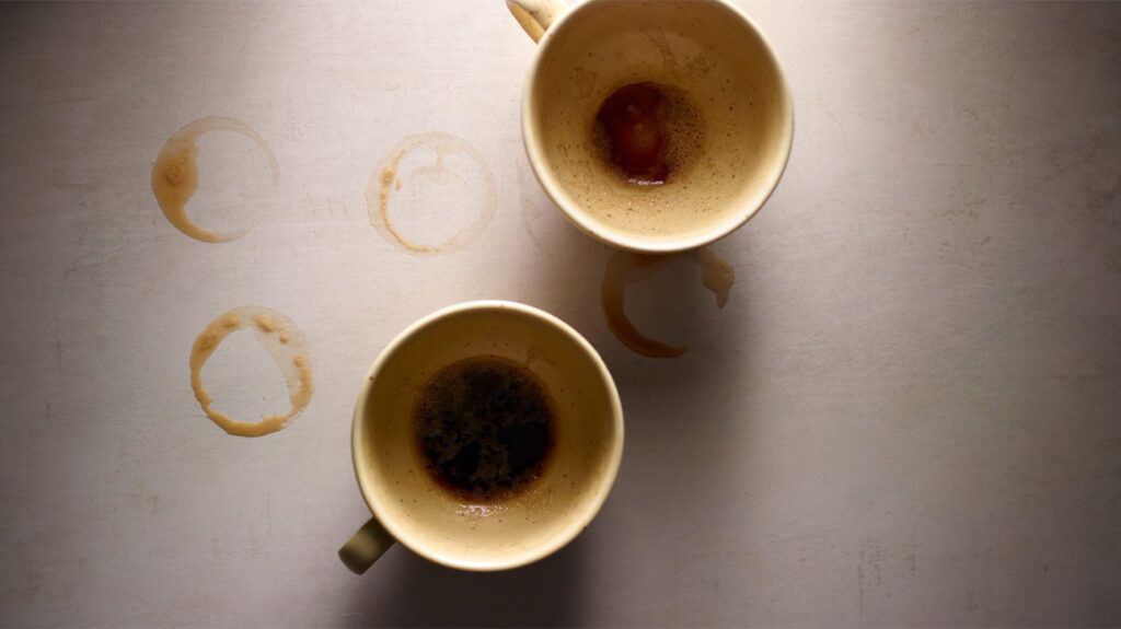 Empty cups of coffee on a table.