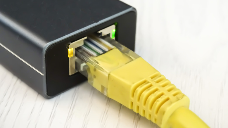 An Ethernet cable plugged into a USB hub