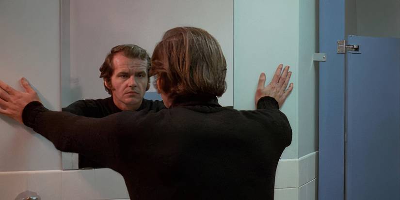 Bobby looks in the mirror in Five Easy Pieces