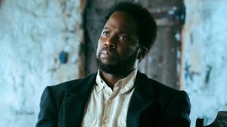 Boyd Stevens (Harold Perrineau) sits down stoically in From