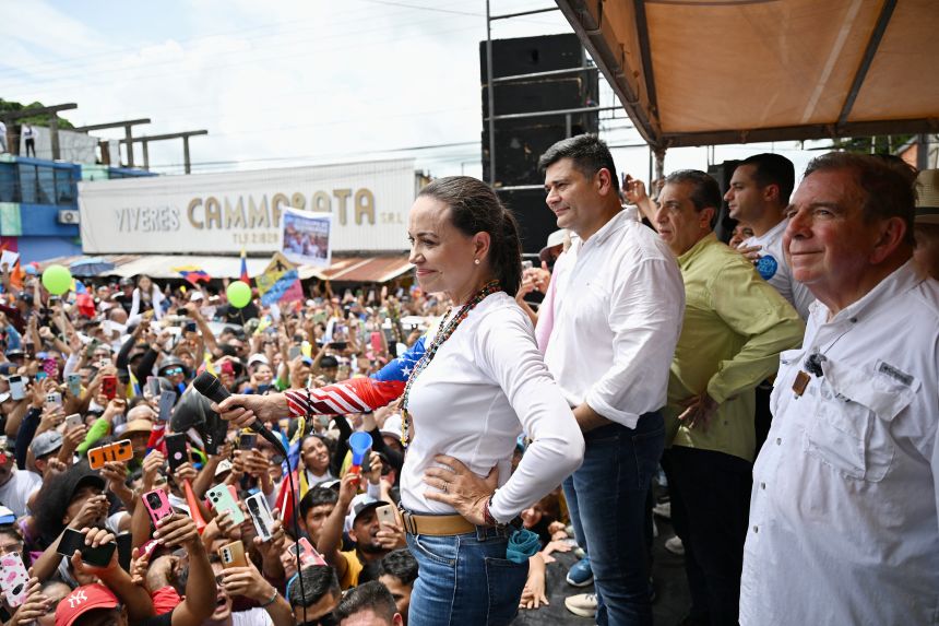 Venezuelan opposition leader Maria Corina Machado (L) gestures next to Venezuelan presidential candidate Edmundo Gonzalez (R) during a campaign rally in Barinas, Venezuela, on July 6, 2024.