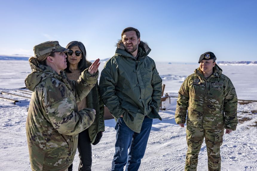 US Vice President JD Vance, and second lady Usha Vance stand with Col. Susan Meyers, commander of the US military's Pituffik Space Base, as they tour the base.