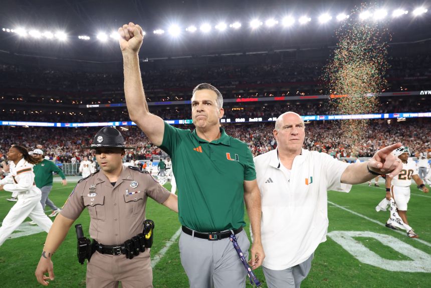 Mario Cristobal celebrates after his Miami team defeated Ole Miss in the Fiesta Bowl, booking a spot in Monday night's title game.