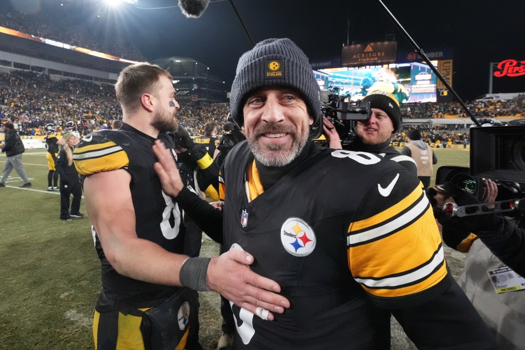 Pittsburgh Steelers quarterback Aaron Rodgers (8) greets tight end Pat Freiermuth (88) after an NFL football game against the Baltimore Ravens, Sunday, Jan. 4, 2026.