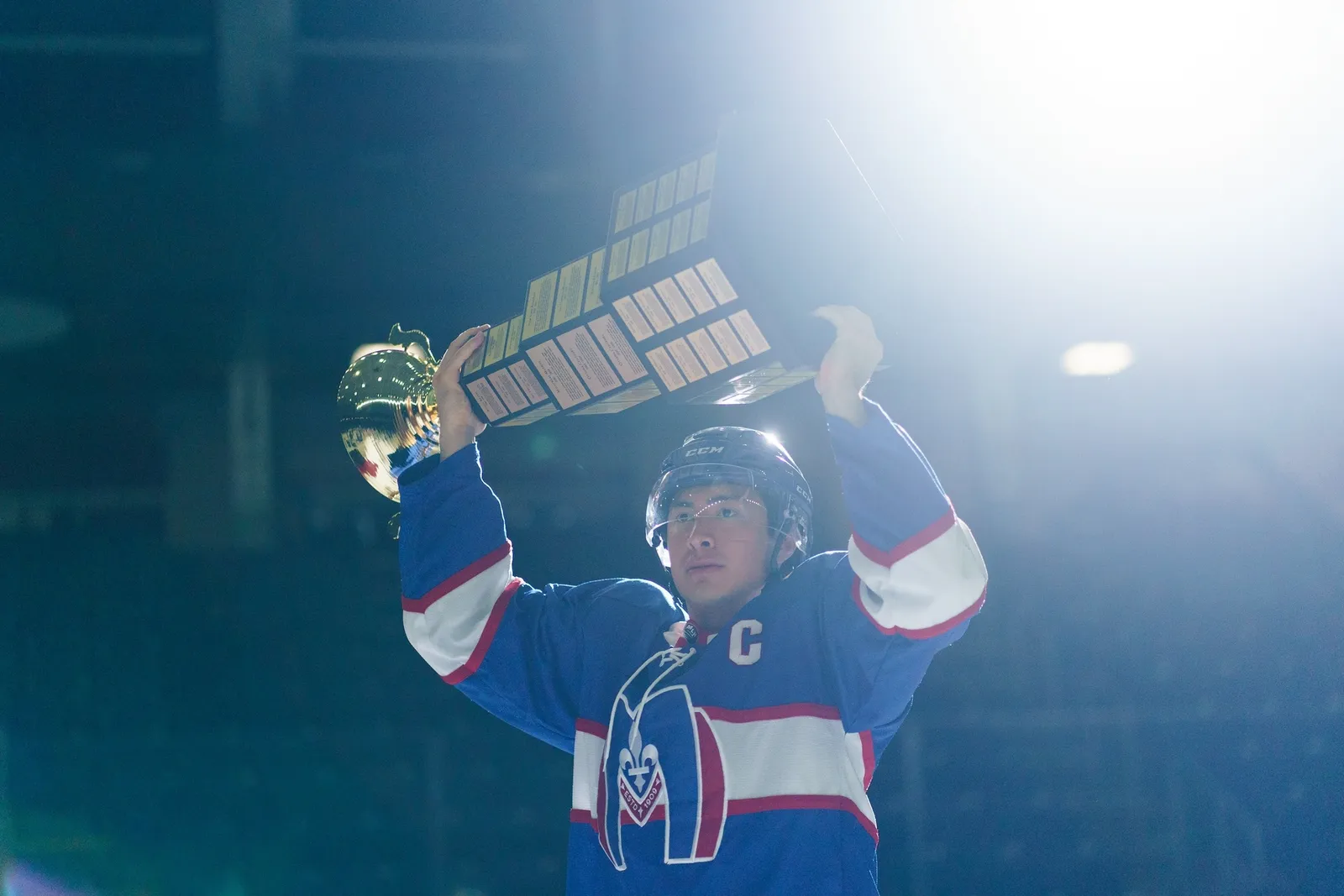 Image may contain Helmet Head Person Face Adult Lighting Happy and Triumphant