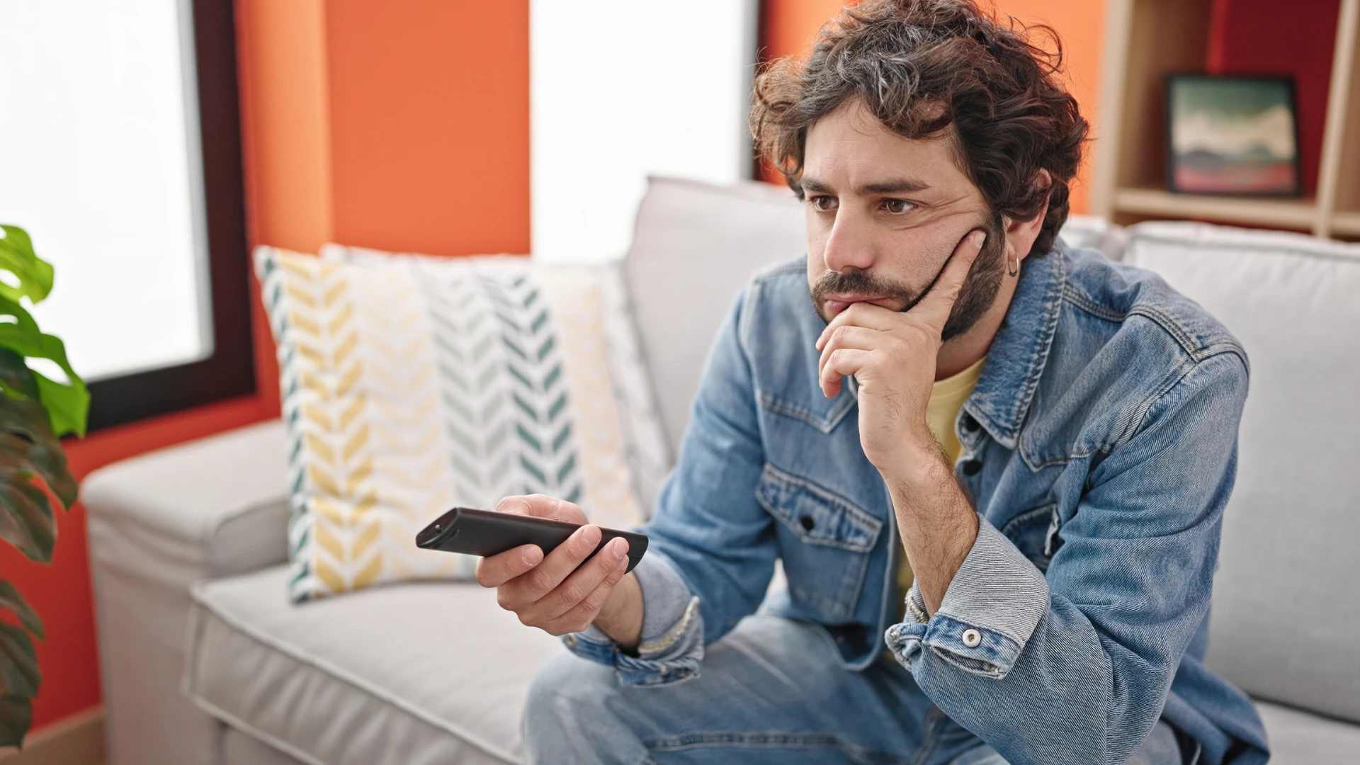 man watching his comfort movies at home