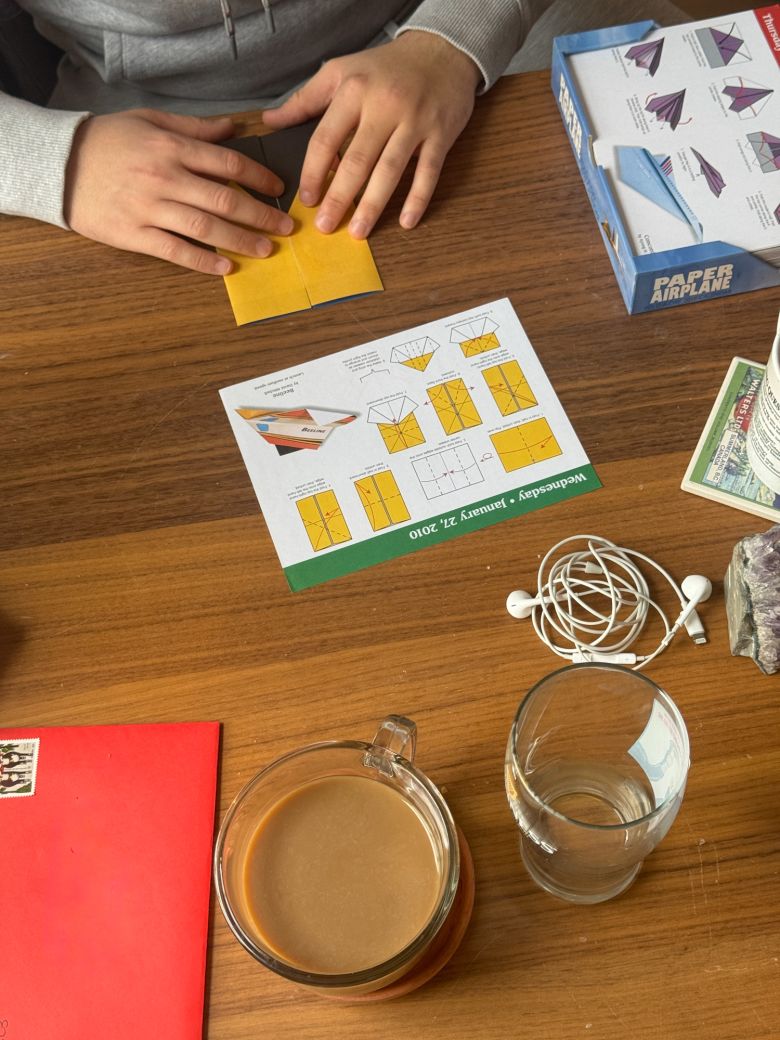 Barker's partner works on one of his paper crafts rather than doomscrolling in the mornings