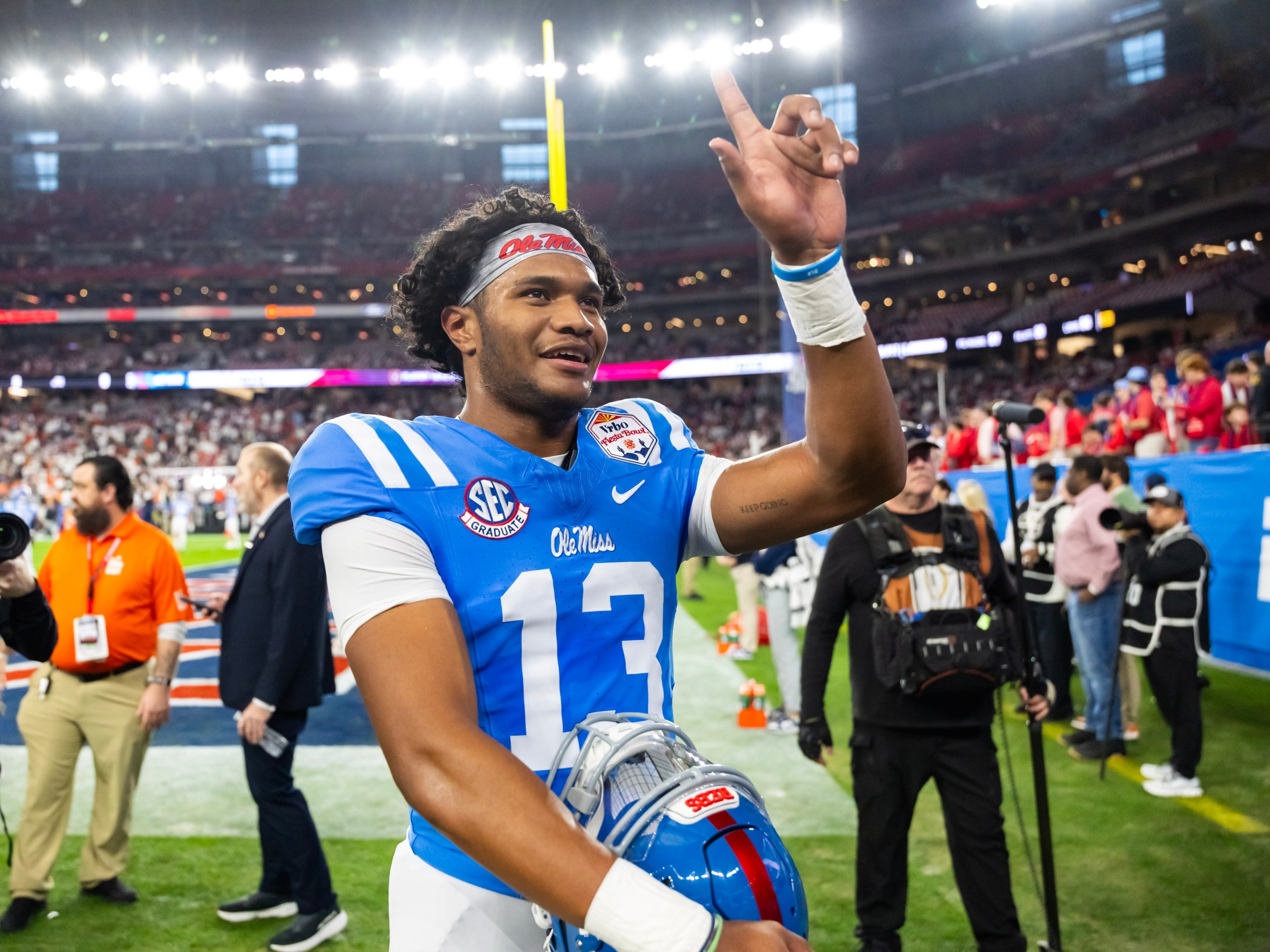 Jan 8, 2026; Glendale, AZ, USA; Mississippi Rebels quarterback Austin Simmons (13) against the Miami Hurricanes during the 2026 Fiesta Bowl and semifinal game of the College Football Playoff at State Farm Stadium. Mandatory Credit: Mark J. Rebilas-Imagn Images