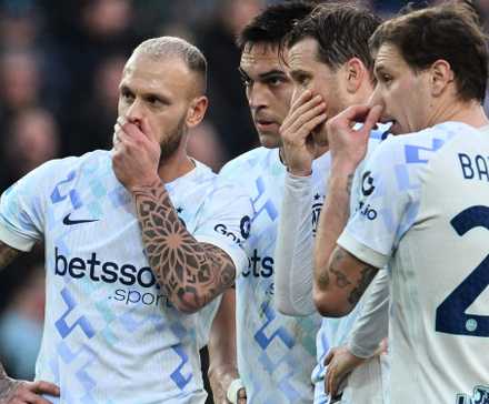 Inter Milan's Federico Dimarco, Lautaro Martinez, Piotr Zielinski and Nicolo Barella react